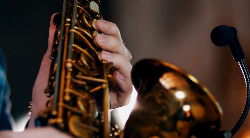 Close-up of a hand holding a saxophone