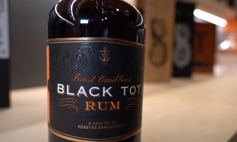 Close up photo of a black rum bottle
