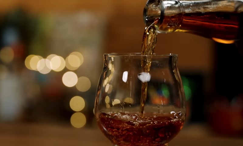 Blackstrap rum poured into a glass