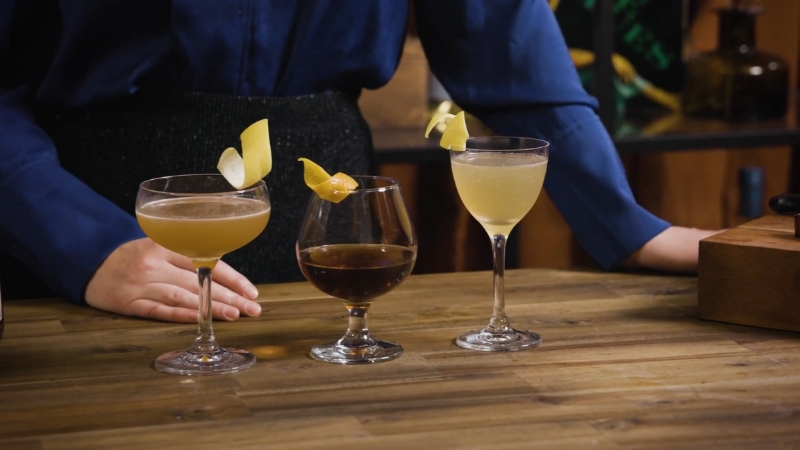Different glasses used for brandy tasting on a bar counter